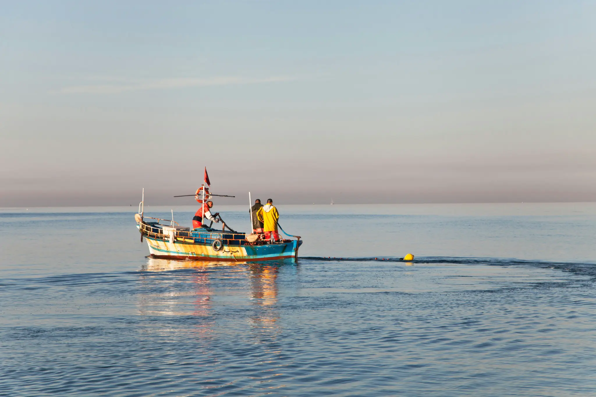 Coastal community members working alongside marine scientists on reef restoration